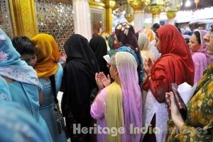 A Woman Raises Her Hands in Prayers at Hazrat Nizamuddin Dargah